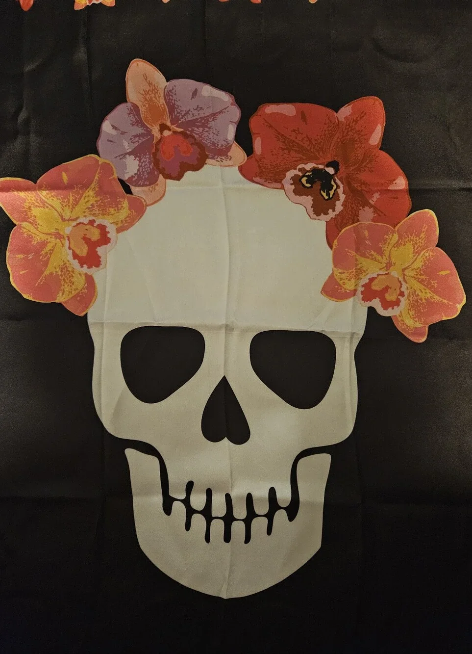 Betsey Johnson 100% polyester black scarf with skull and flowers.
